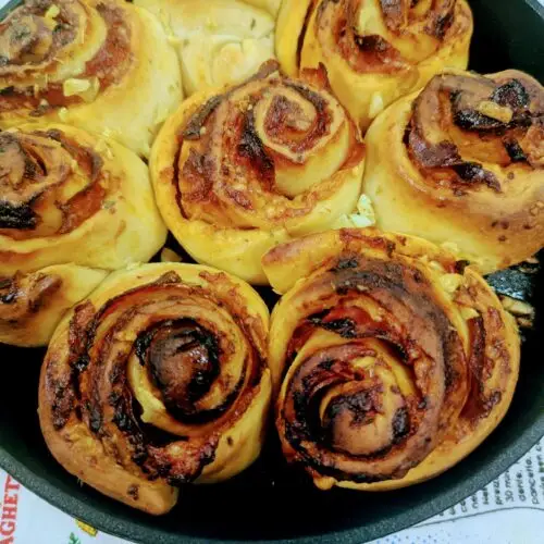 Golden brown rosette stromboli made with Birrittella's pizza dough, baked in a cast iron skillet and brushed with garlic herb butter.