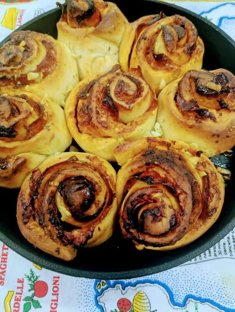 Golden brown rosette stromboli made with Birrittella's pizza dough, baked in a cast iron skillet and brushed with garlic herb butter.